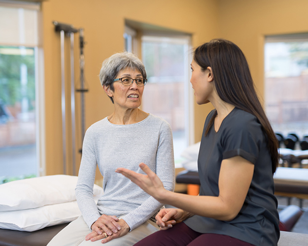 Therapist helping patient with speech therapy